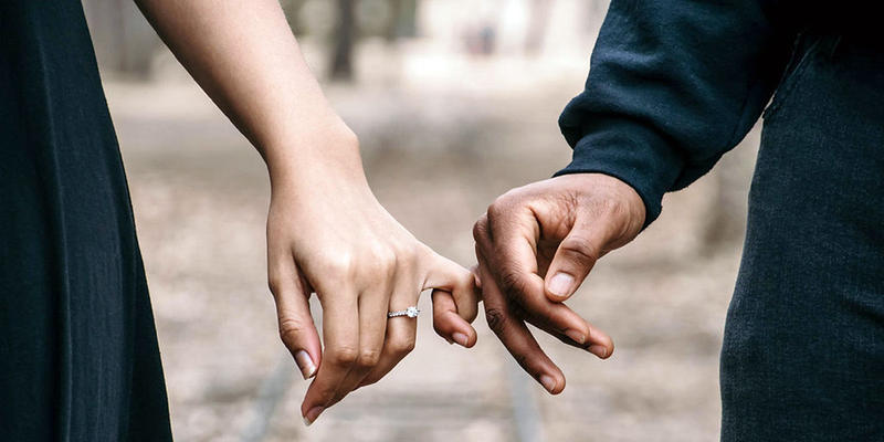 COUPLE HOLDING HANDS