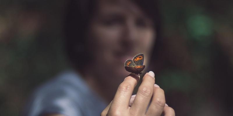 WOMAN WITH BUTTERFLY