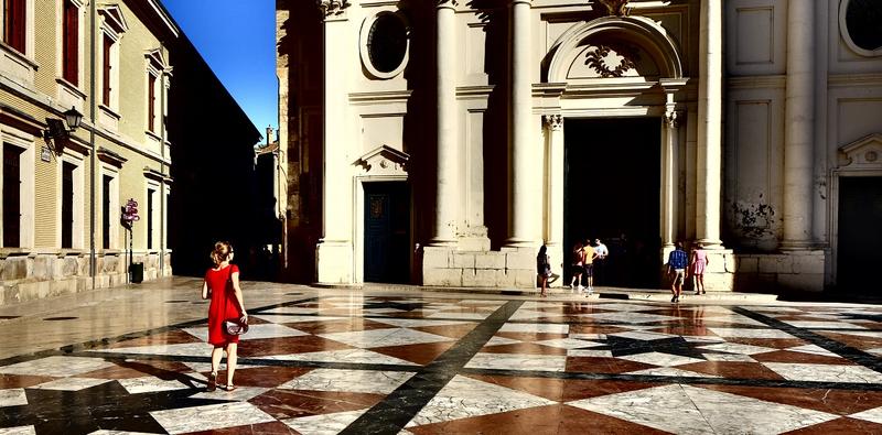 WOMAN IN FRONT OF THE CHURCH