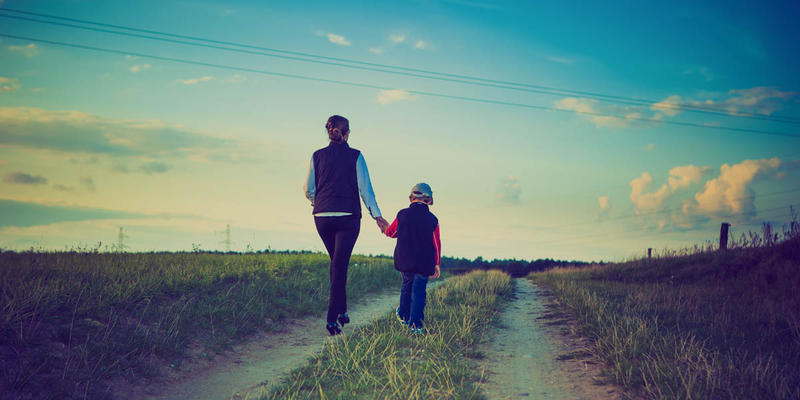 WOMAN CHILD WALKING ON PATH