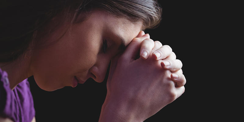 WOMAN PRAYING