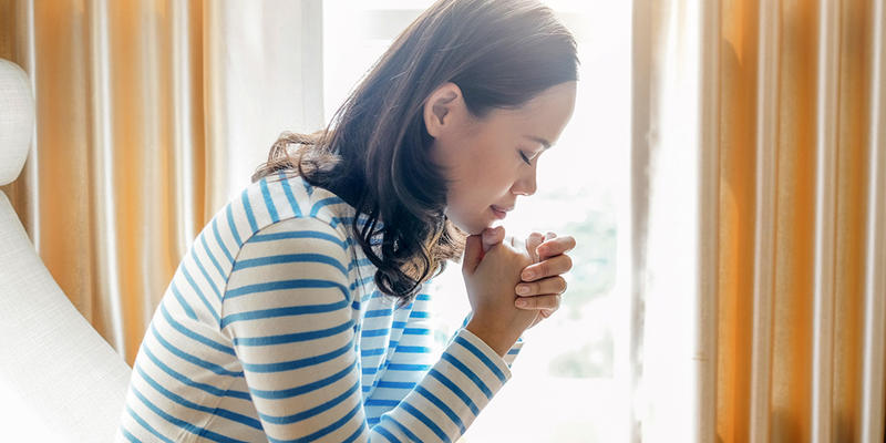 WOMAN PRAYING