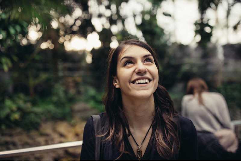 excited woman looking up smiling