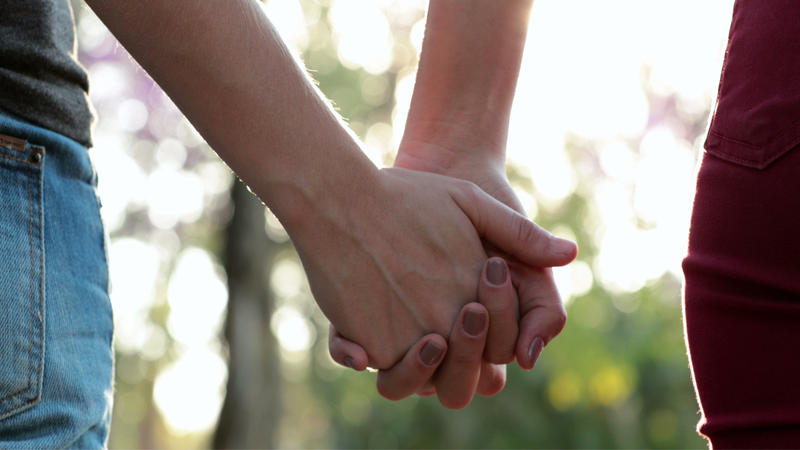 hands together sunlight