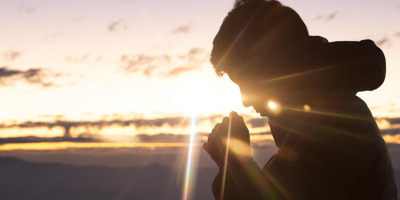 christian man hand praying