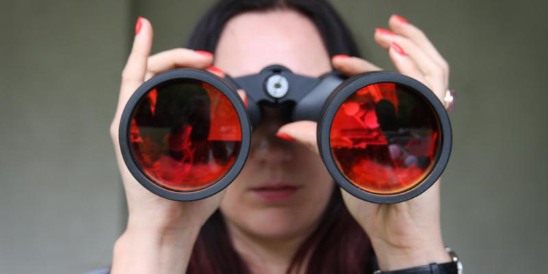 WOMAN, BINOCULARS, RED