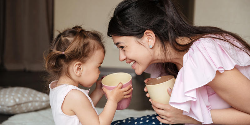 mother drinking tea with her daughter