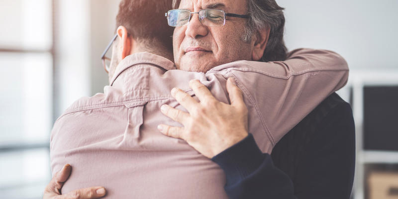son hugs father