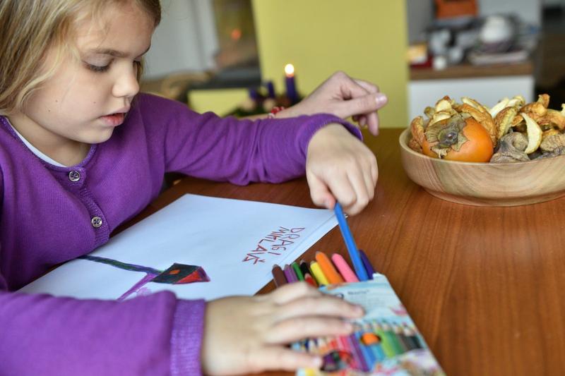 GIRL WRITING LETTER TO ST. NICHOLAS
