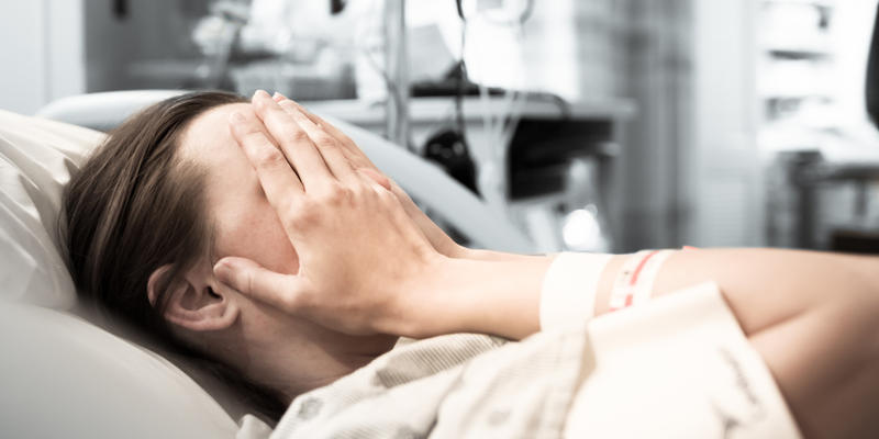 WOMAN, HOSPITAL, SAD