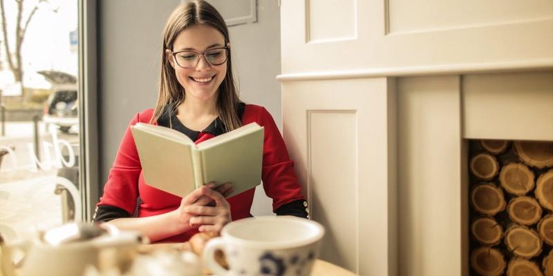 GIRL READING A BOOK