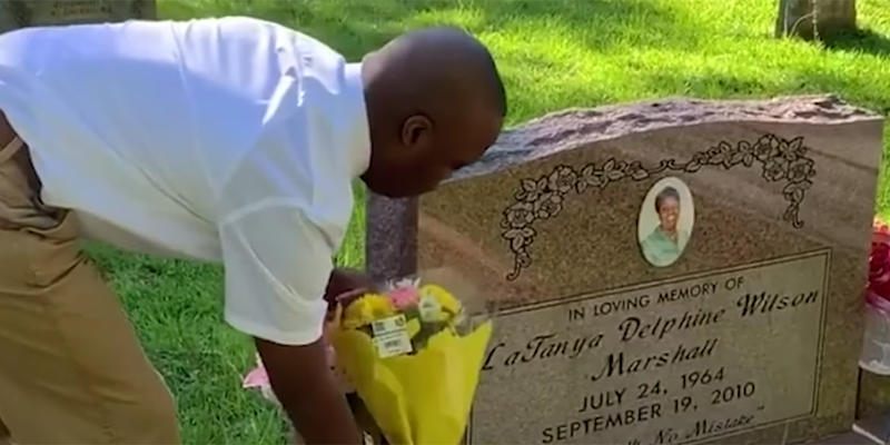 CHILD VISITING MOTHER'S GRAVE
