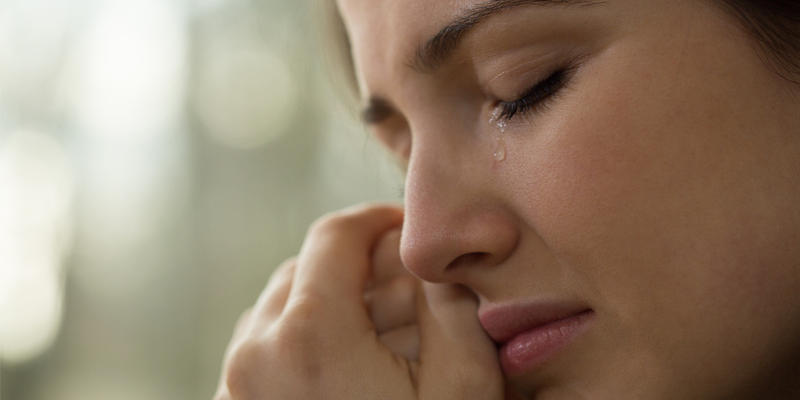WOMAN CRYING,