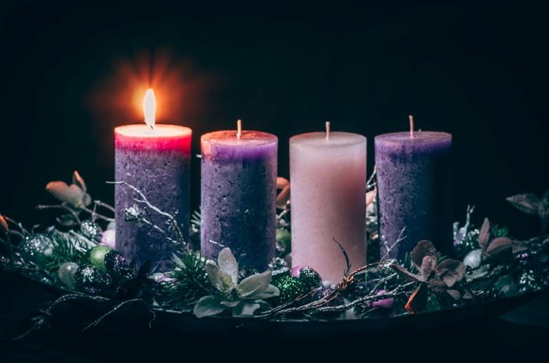 advent cristian concept with 1 pink candle and 3 purple candles